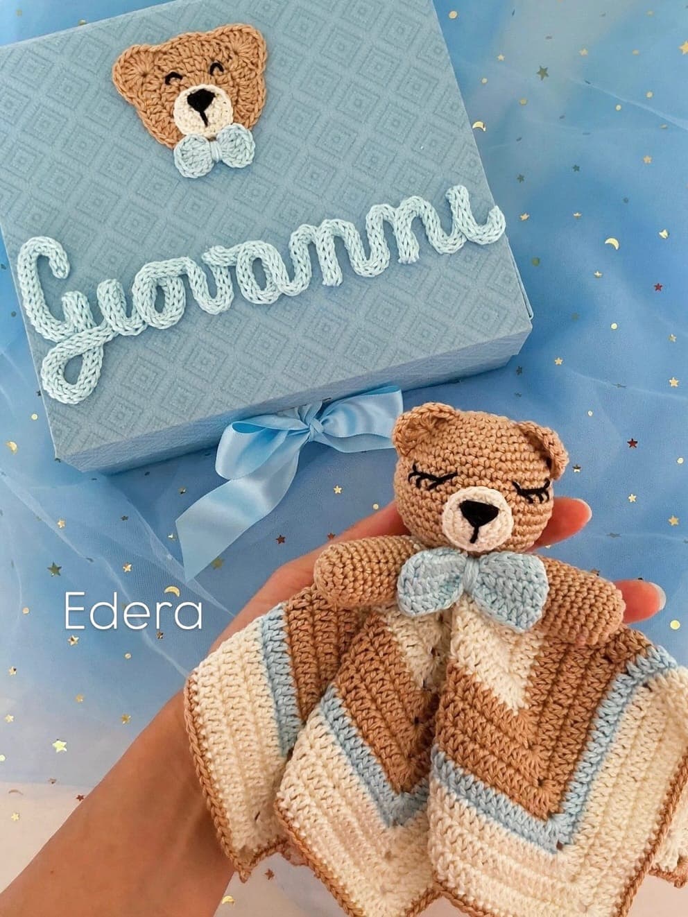 Striped teddy lovey with a gift box bearing the name Giovanni in crochet